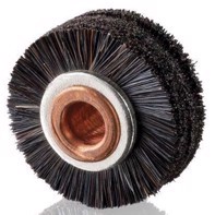 Black brush wheels on Komori machines