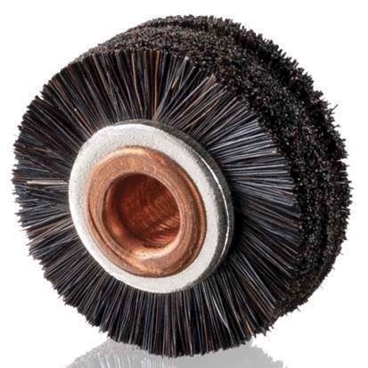 Black brush wheels on Komori machines